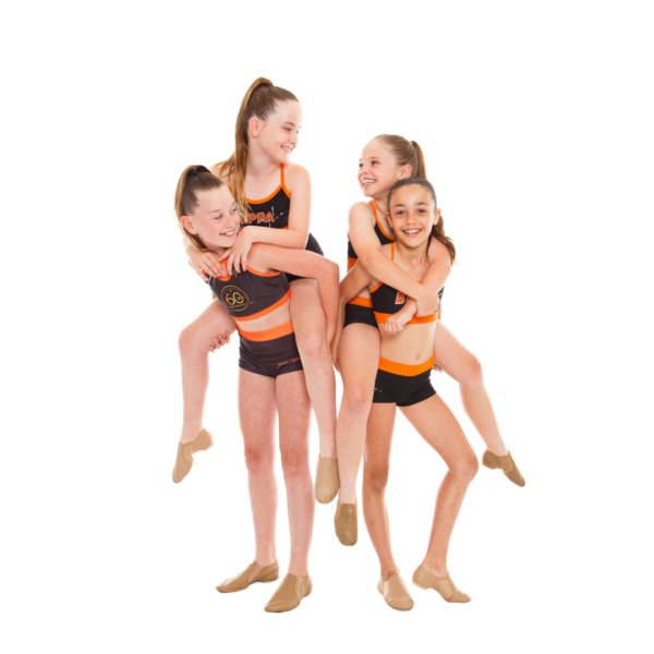 Four dance students in black and orange uniforms posing together